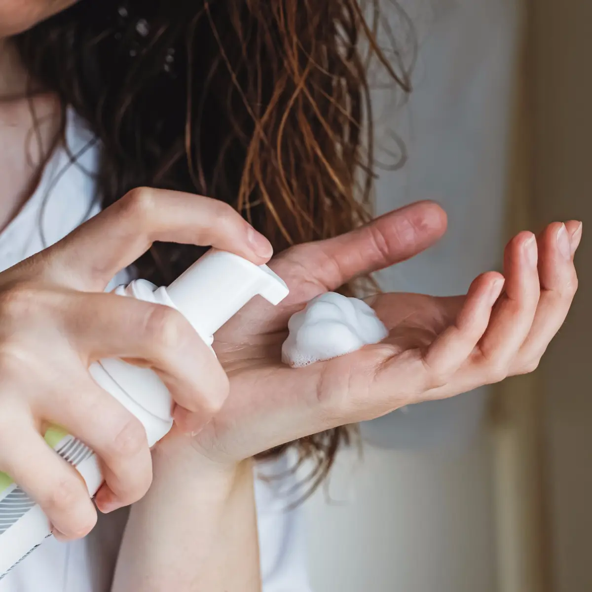 woman-pushing-down-hair-product