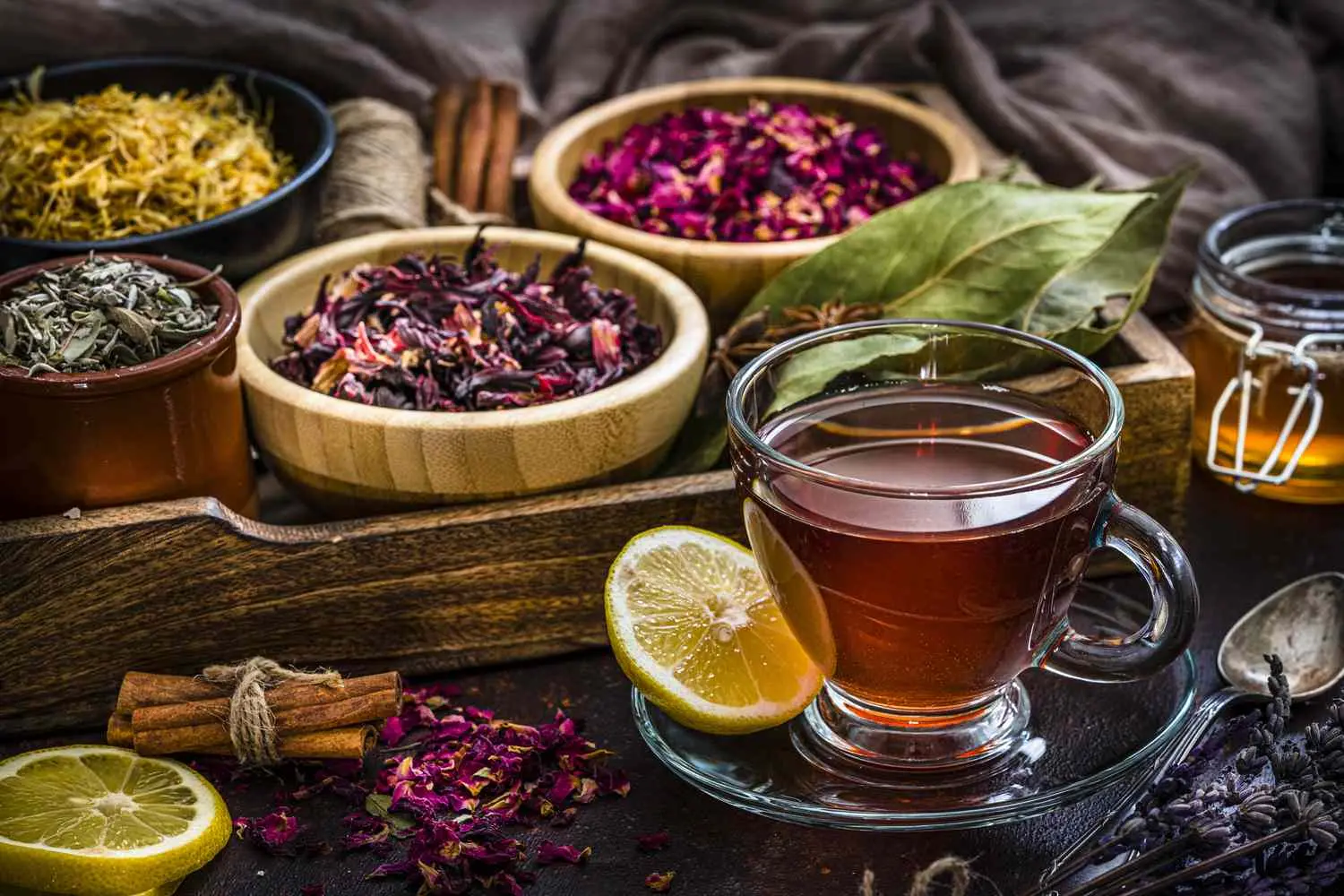 tea-cup-with-several-dried-tea-leaves-and-flowers-1201496311-55f0a4dfdbc54605966a0a9ec2f40f3c