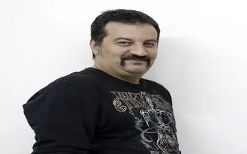 عکسی دیدنی از پدری کردن آقای کارگردان چاق و باحال