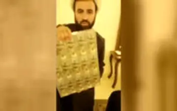 روحانی قلابی لبنانی که بین مردم دلار پخش می‌کرد