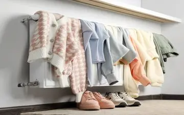 هشدار کارشناسان درباره خشک کردن لباس روی رادیاتور و بخاری
