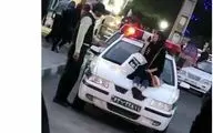 ماجرای دختر بدحجابی که  روی کاپوت خودروی نیروی انتظامی نشست