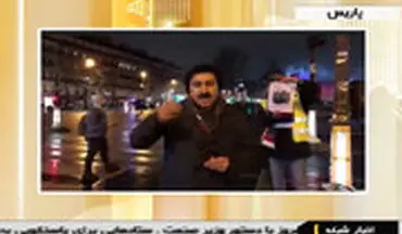پوستر حاج قاسم سلیمانی در دست معترضان جلیقه زرد پاریسی