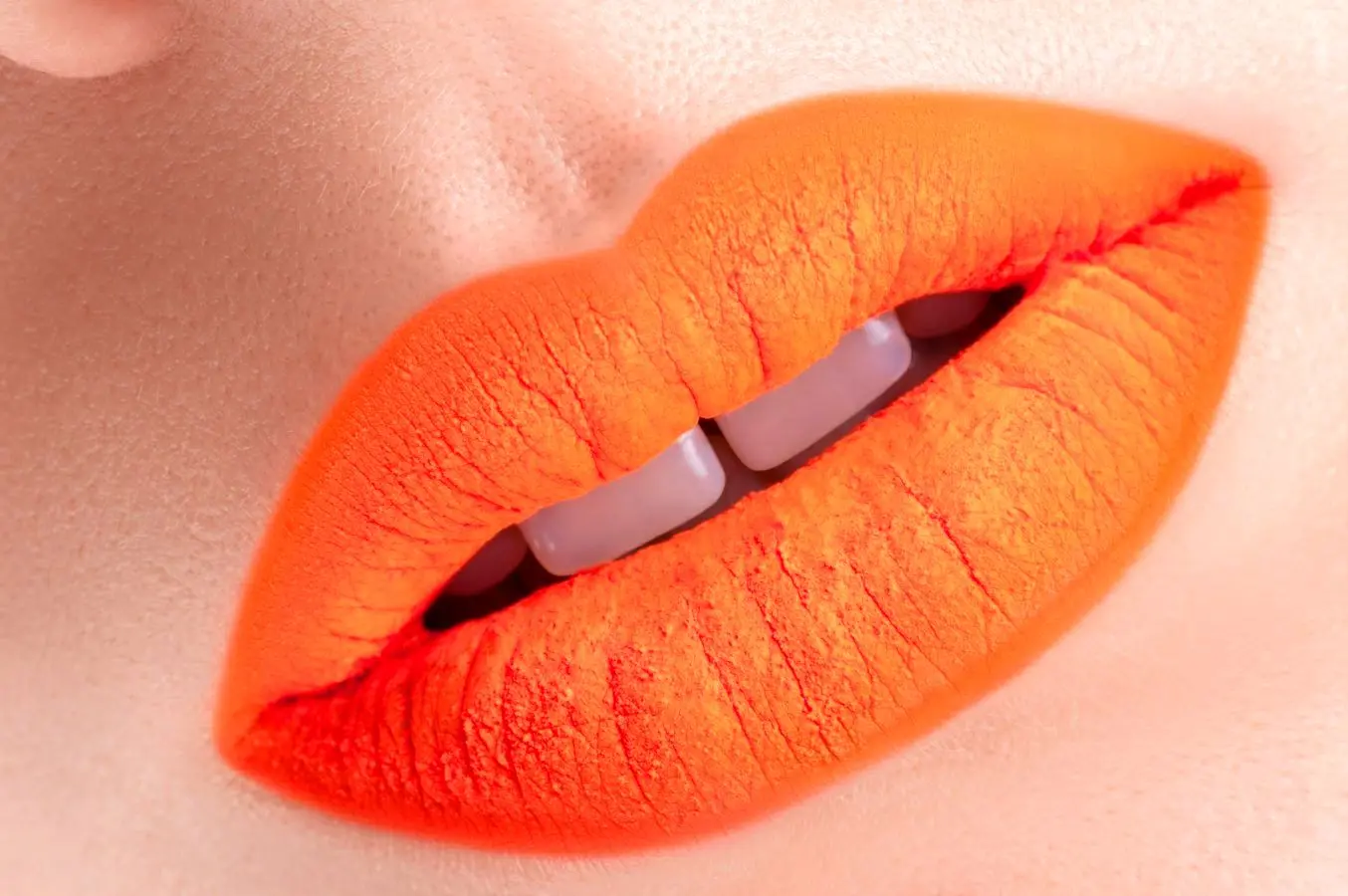 The hottest makeup trend for summer? Orange lipstick