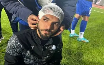  مصدومیت بازیکن استقلال با سنگ‌پرانی پرسپولیسی‌ها و سلام نظامی هاشمی‌نسب + عکس