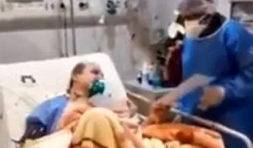 ویدئویی از پزشک مبتلا به کرونا که از روی تخت ، مریض ویزیت می‌کند