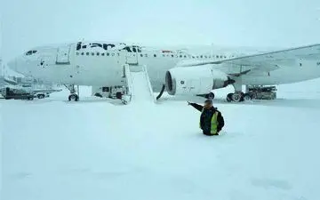 بارش نیم‌متری برف در فرودگاه امام خمینی(ره)/عکس