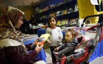 گزارش تصویری  از حضور خردسالان، کودکان در چهاردهمین نمایشگاه کتاب  کرمانشاه